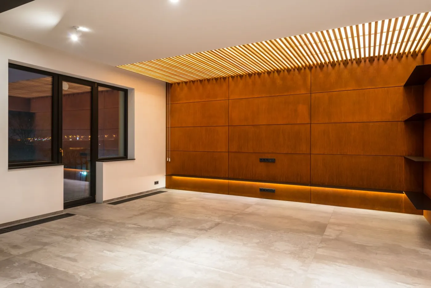 Warm cove-lit interior with recessed LED downlights