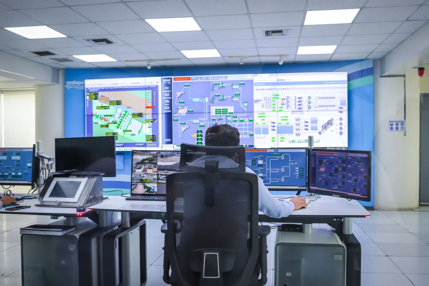 Building management control room with system schematics