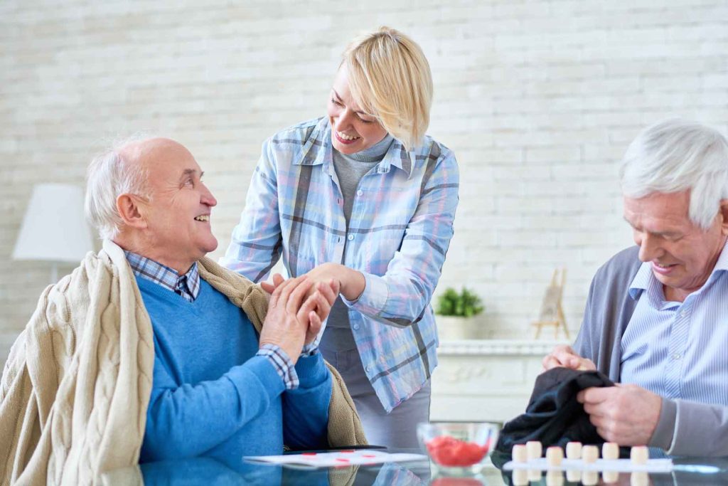 Seniors in a retirement-home common area — SaniLume deployment space