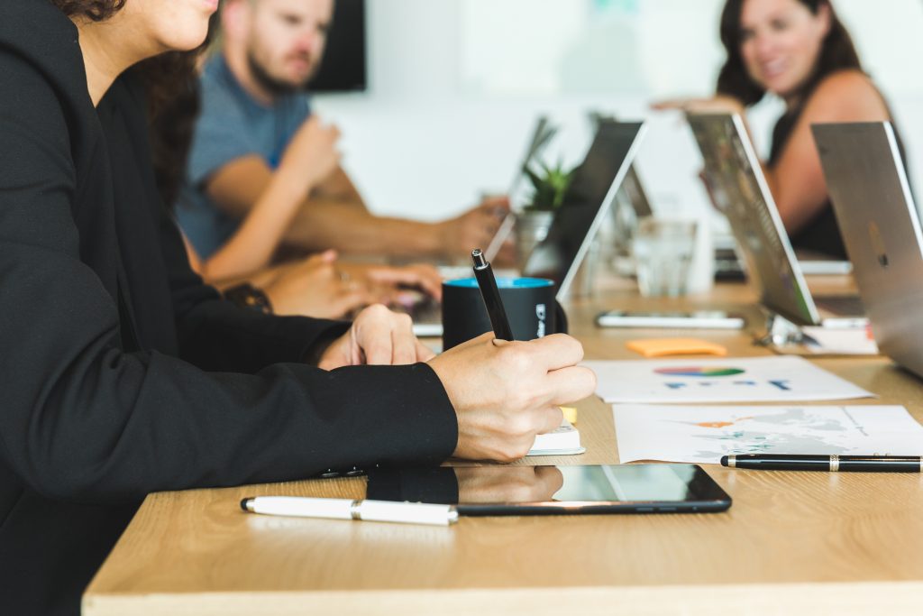 Team meeting in an office — SaniLume deployment space