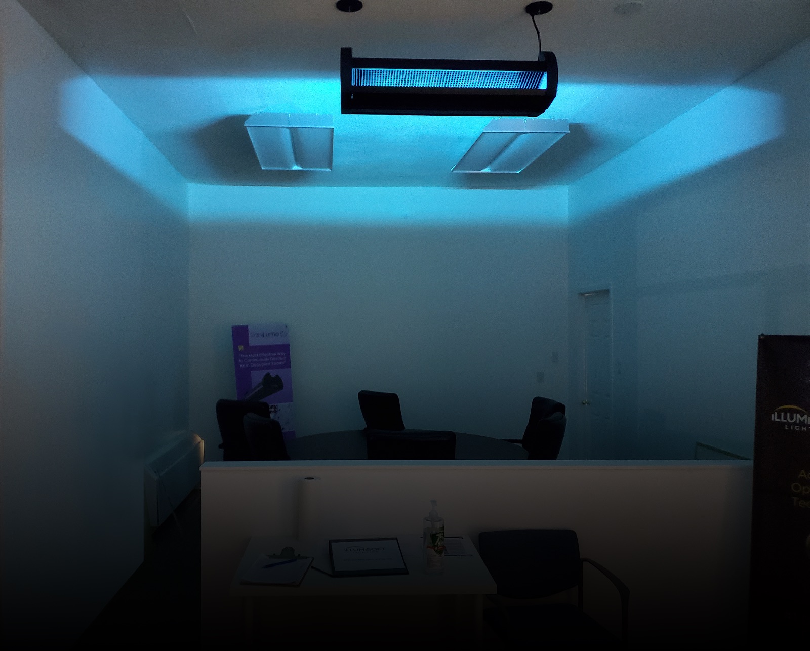SaniLume fixture emitting germicidal UV in an upper-room treatment zone